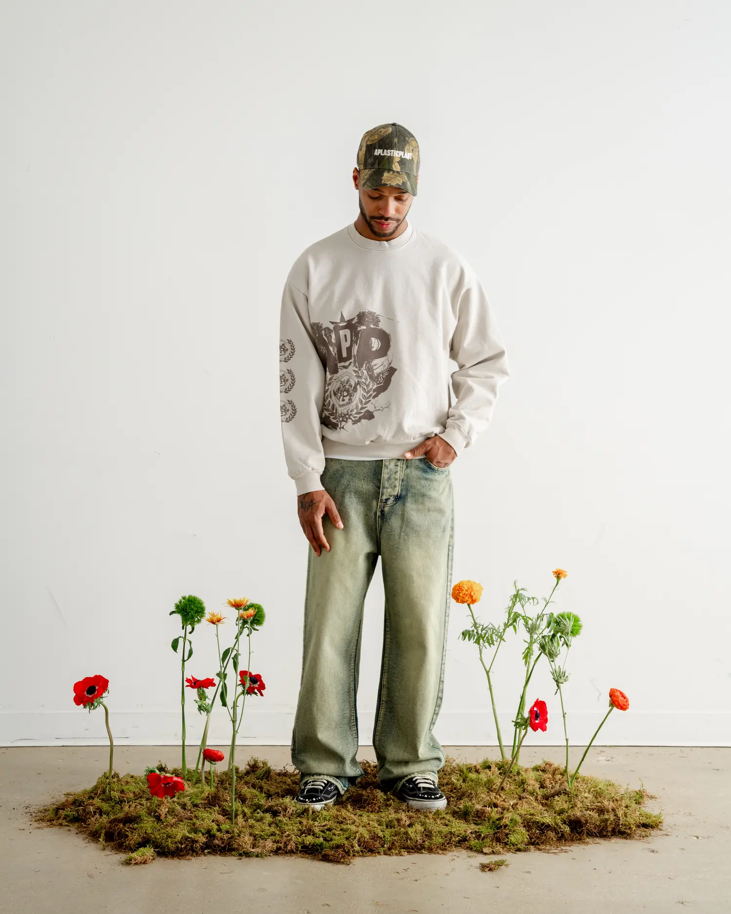 The crewneck head to toe, standing on the moss patch