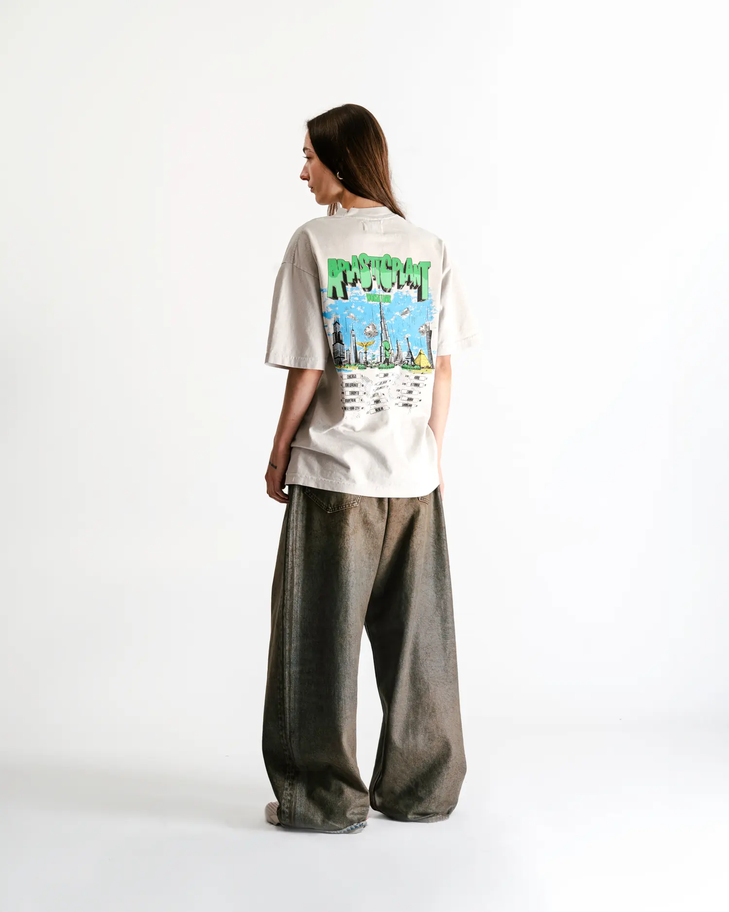 The tour tee walking away, back print in three quarters