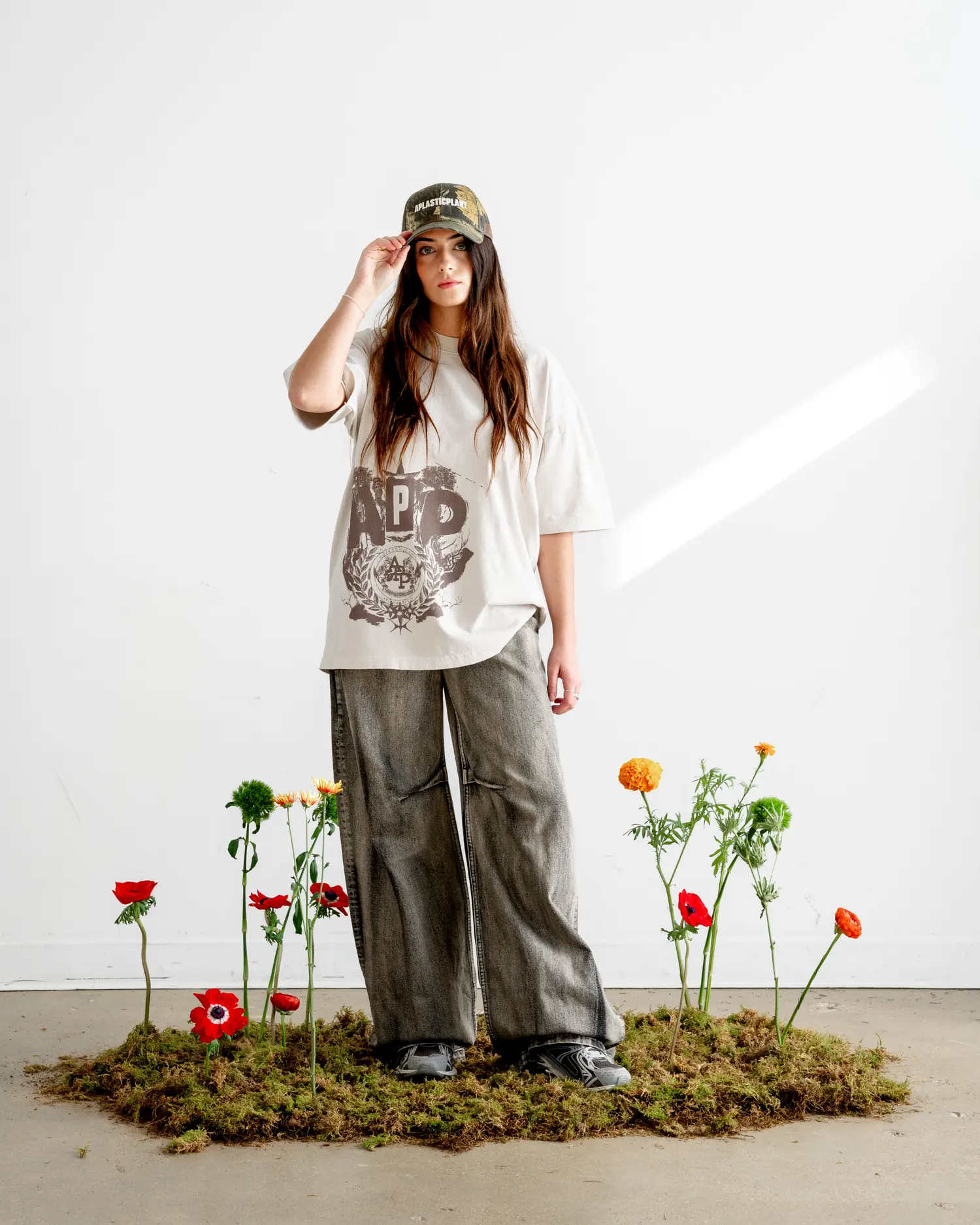 The crest tee head to toe, standing on the moss patch