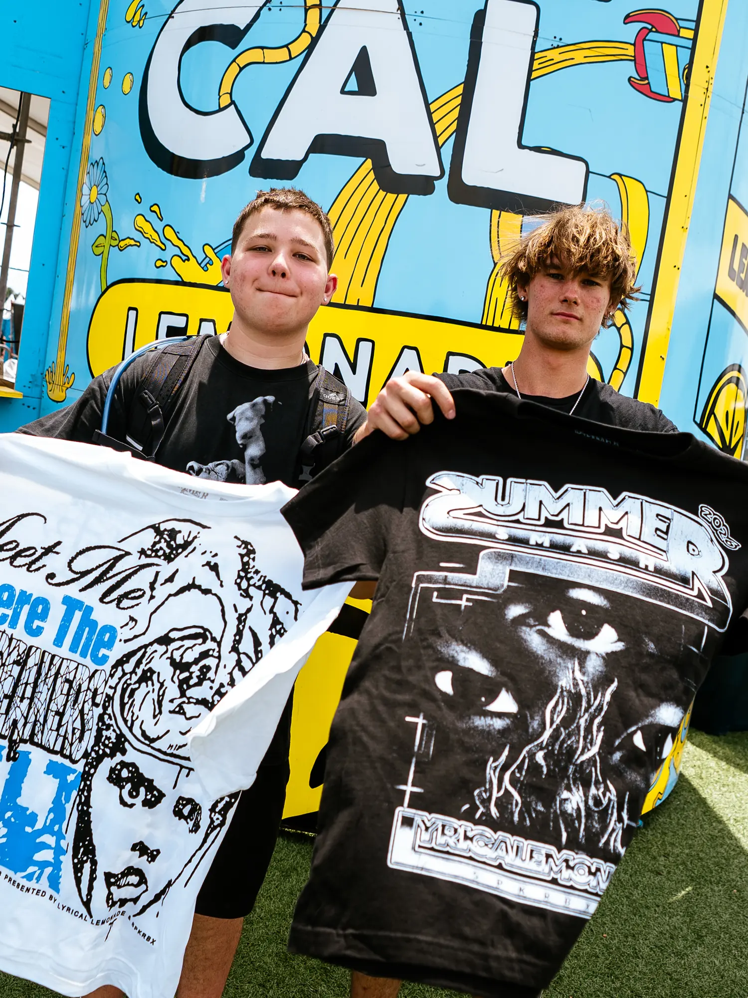 Both tees held up at the Lyrical Lemonade stand